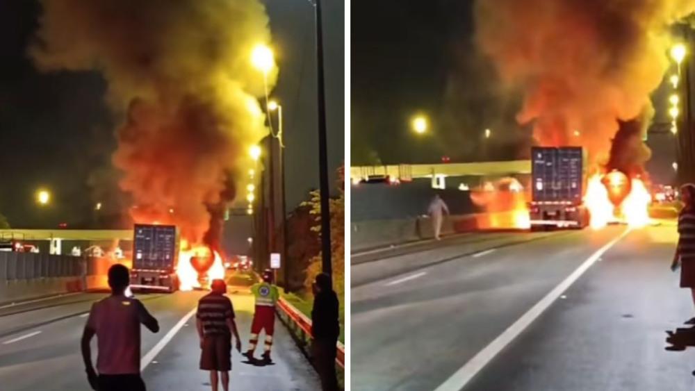 Colisão entre carretas provoca incêndio na estrada, em Guarujá; VÍDEO