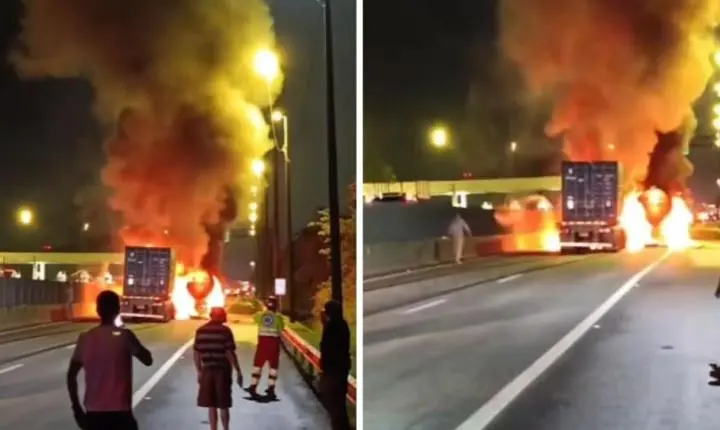 Colisão entre carretas provoca incêndio na estrada, em Guarujá; VÍDEO